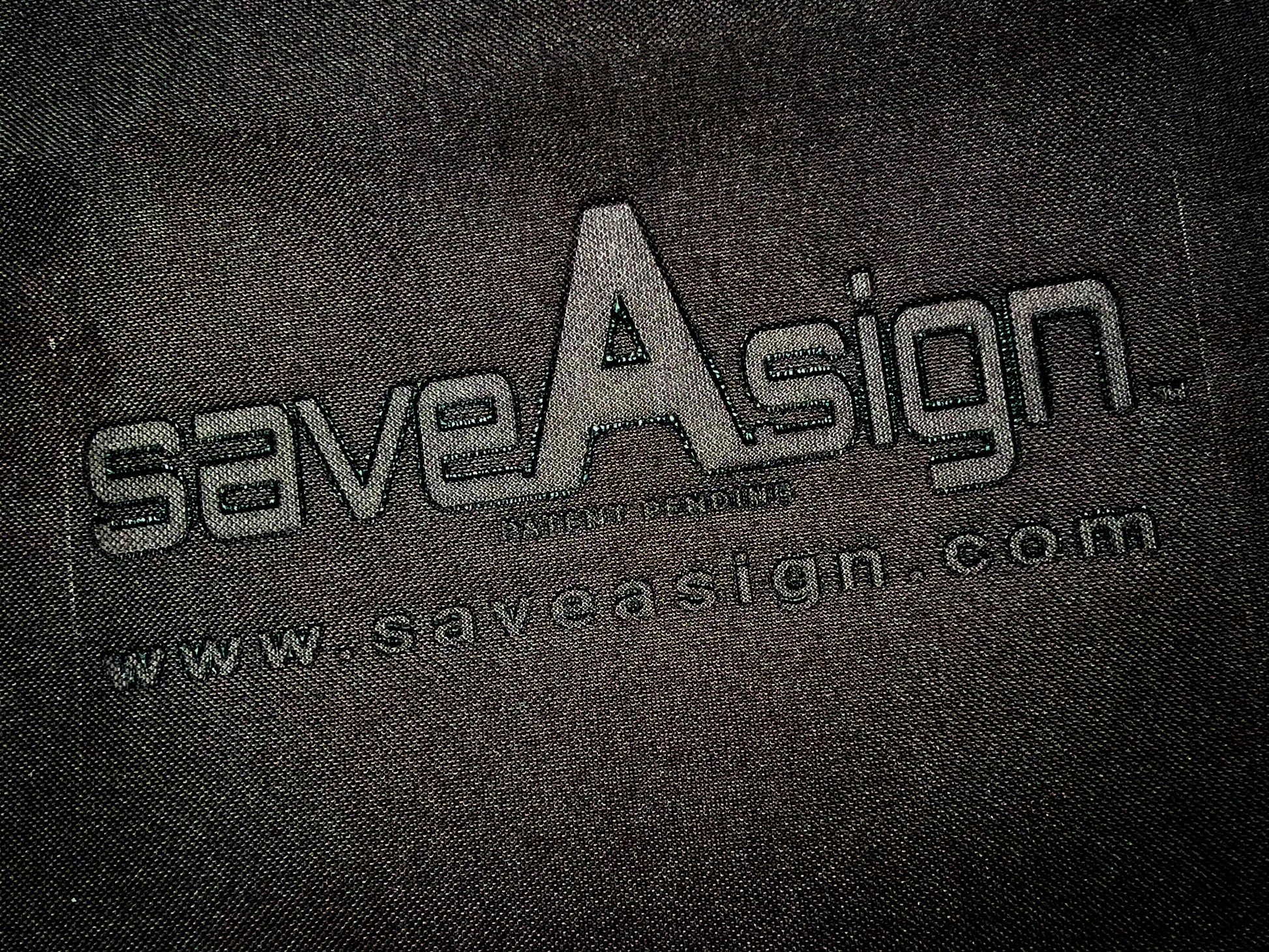 close up of the saveAsign™ logo embossed on our patent pending real estate sign cover 